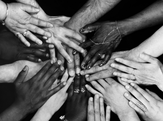 diverse hands in circle